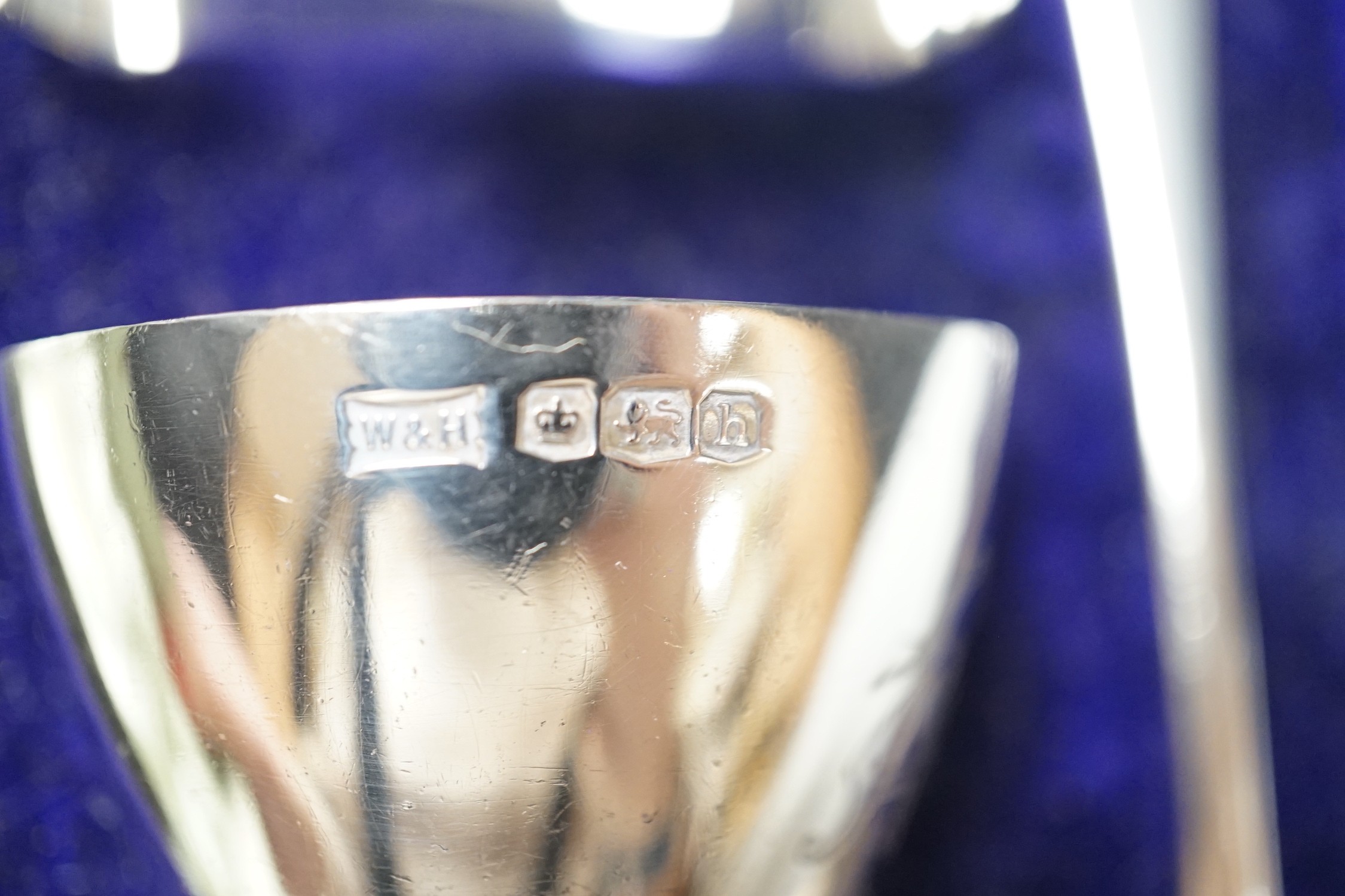 A cased George V silver christening trio, by Walker & Hall, Sheffield, 1925 and a cased silver christening spoon & fork, Henry Wigful, Sheffield, 1925.